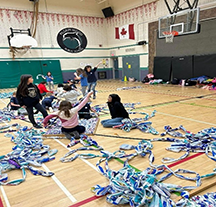 Oakville Trefoil Guild helping with milk bag mats.